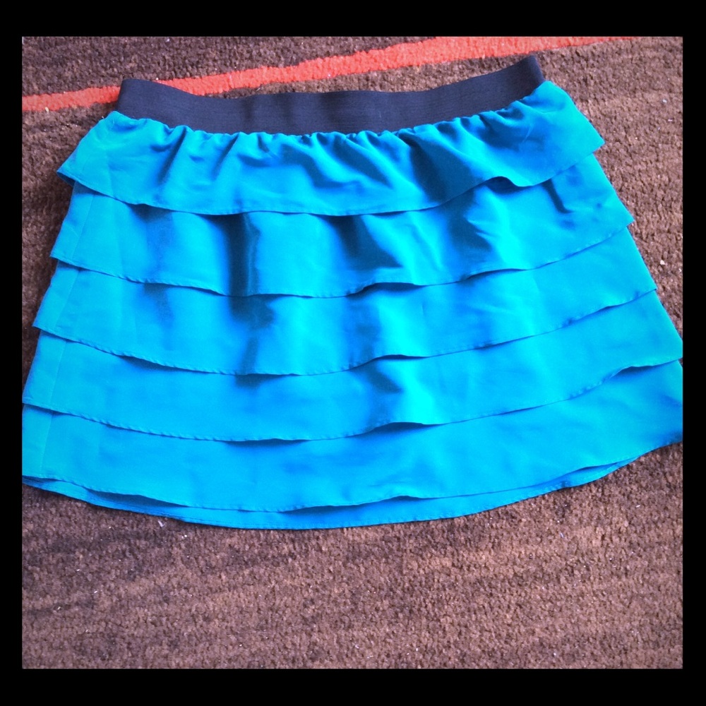 Turquoise ruffle skirt.